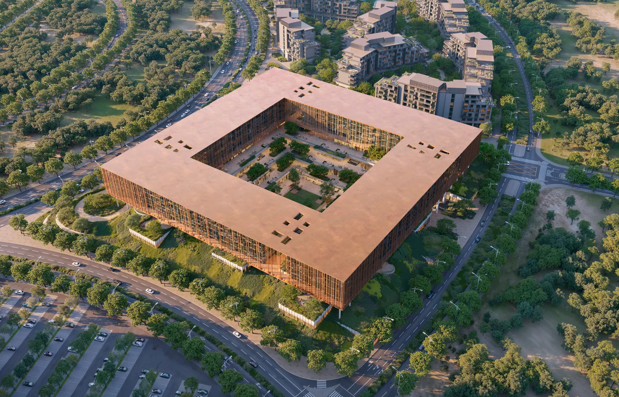 Aerial view: the square ring of The Yards Plaza around its green courtyard, set within The Yards masterplan