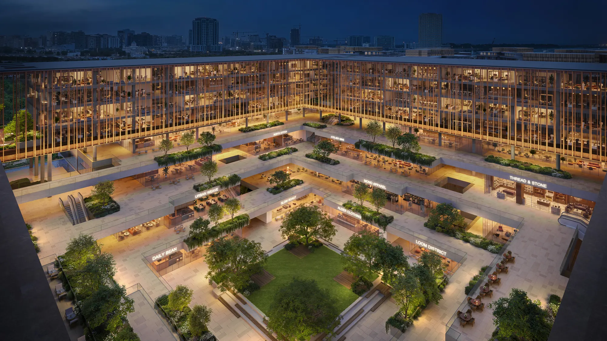 The courtyard after dark, lit paths and planting framed by glowing façades